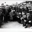 Ellen Wilkinson, the MP for Jarrow, has a few words for the Jarrow marchers' mascot dog as they reach Harrogate. (Photo by Hulton Archive/Getty Images)