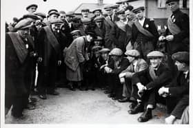 Ellen Wilkinson, the MP for Jarrow, has a few words for the Jarrow marchers' mascot dog as they reach Harrogate. (Photo by Hulton Archive/Getty Images)