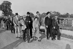 The Jarrow marchers whistle a merry tune - with their mouth organ band further back in the ranks - as the crusade continues.
(Photo by David Savill/Topical Press Agency/Getty Images)