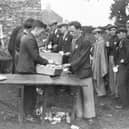 Jarrow marchers stop for a much needed sandwich.  (Photo by Fox Photos/Getty Images)