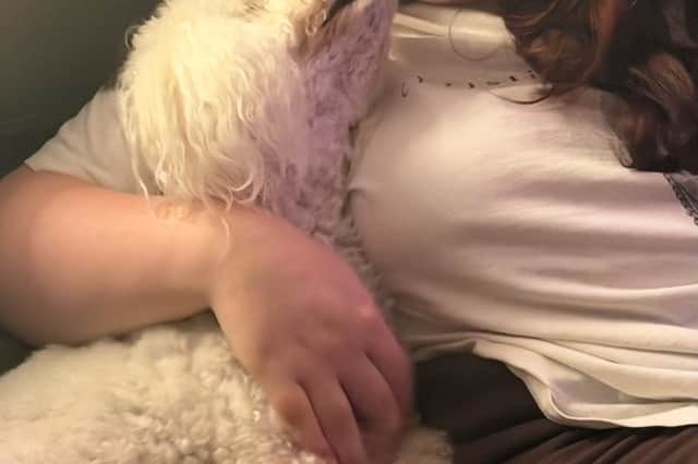 Evie with her own dog at home.