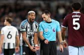 Joelinton of Newcastle United reacts as he speaks with Referee Jarred Gillett during Newcastle's home defeat against Aston Villa.