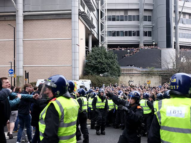 Police officers separate fans of Newcastle United and Sunderland outside the stadium prior to the Premier League match between Newcastle United and Sunderland at St James' Park on March 22, 2026 in Newcastle upon Tyne, England. (Photo by Carl Recine/Getty Images)