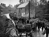 Jarrow marchers passing throught the village of Lavendon, near Bedford, on their way to London, many playing mouth organs to keep spirits up. 
(Photo by Savill/Getty Images)