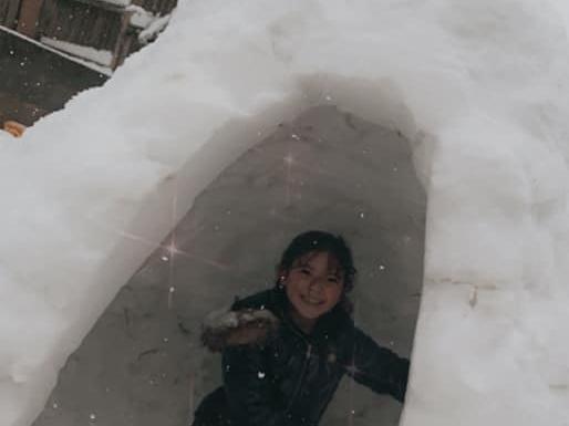 At the end of a long day, Katie's daughter relaxed in her very own igloo!