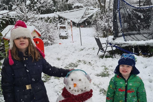 Suzanne Eyre's little ones proudly showed off their snowman.