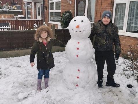 Tanya Carter's little ones had "heaps of fun" creating their snowman - who was almost as big as they are!