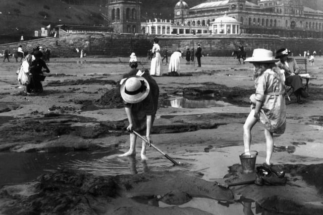 1913: Bathers playing on the sands at Scarborough