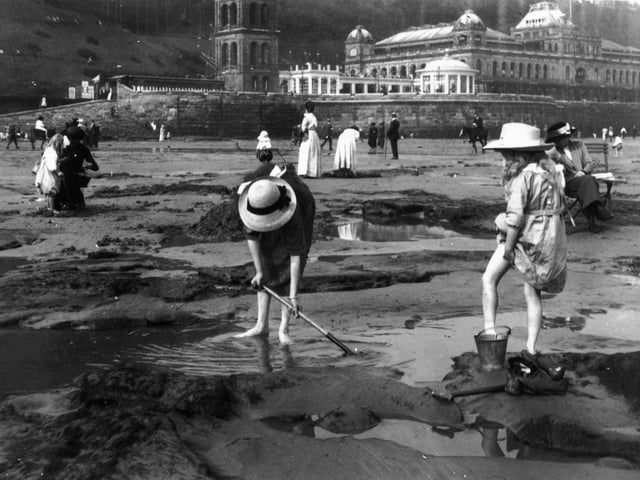 1913: Bathers playing on the sands at Scarborough