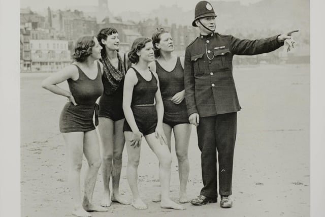 April 1936 The fine weather which has been prevalent for the past few weeks brought out some early bathers at Scarborough, who enjoyed their first dip of the season. A kindly policeman directs the early bathers to the safety bathing area at Scarborough.