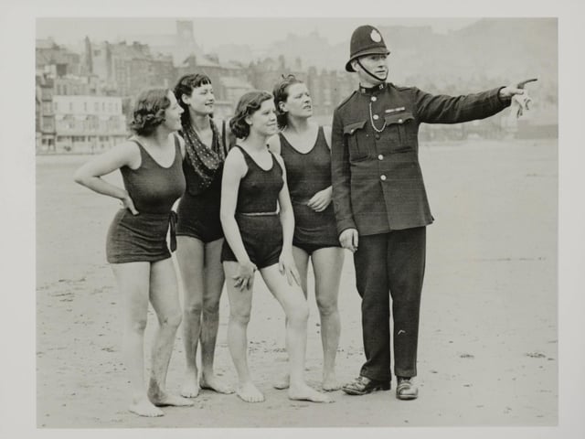 April 1936 The fine weather which has been prevalent for the past few weeks brought out some early bathers at Scarborough, who enjoyed their first dip of the season. A kindly policeman directs the early bathers to the safety bathing area at Scarborough.