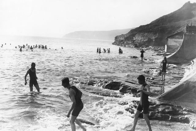 circa 1911: Eager bathers go for an early morning dip at Scarborough, Yorkshire.
