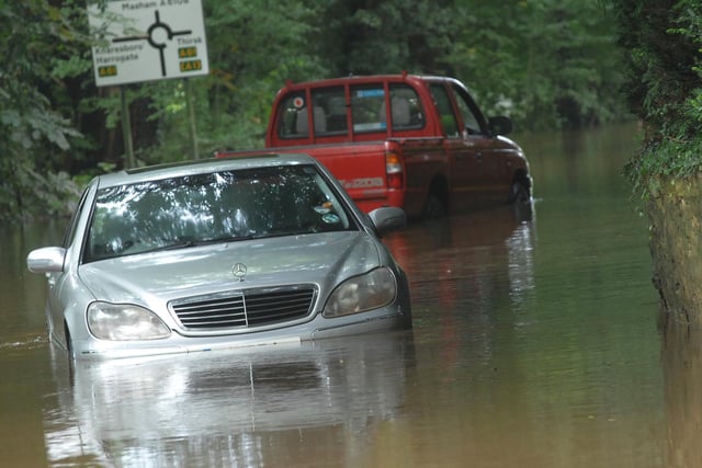 Cars submerged in floodwater on the road in Ripon in 2012.