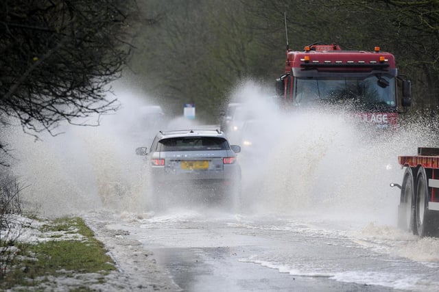 Vehicles struggling through surface flooding on the A59 in 2020.