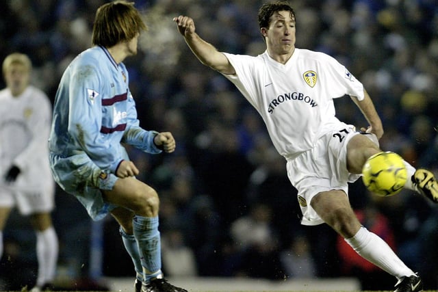Robbie Fowler fires a shot past West Ham United's Sebastian Schemmel during the New Year's Day Premier League clash in 2002. He scored as the Whites cruised to a 3-0 win.