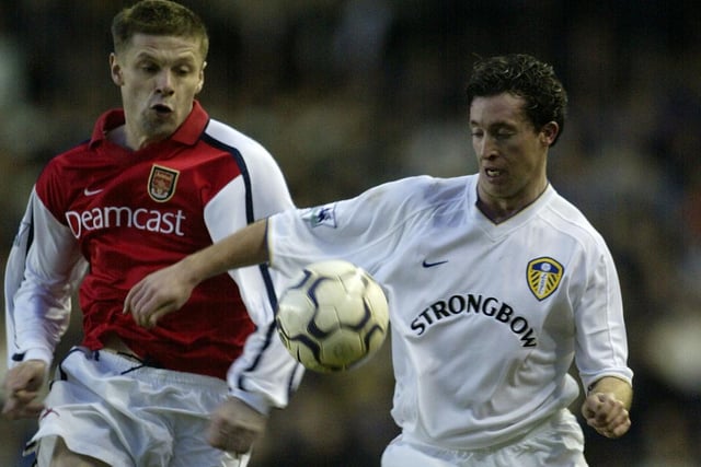 Robbie Fowler clashes with Arsenal's Oleg Luzhny during the Premier League clash at Elland Road in January 2002. He scored as the Whites drew 1-1 with the Gunners.