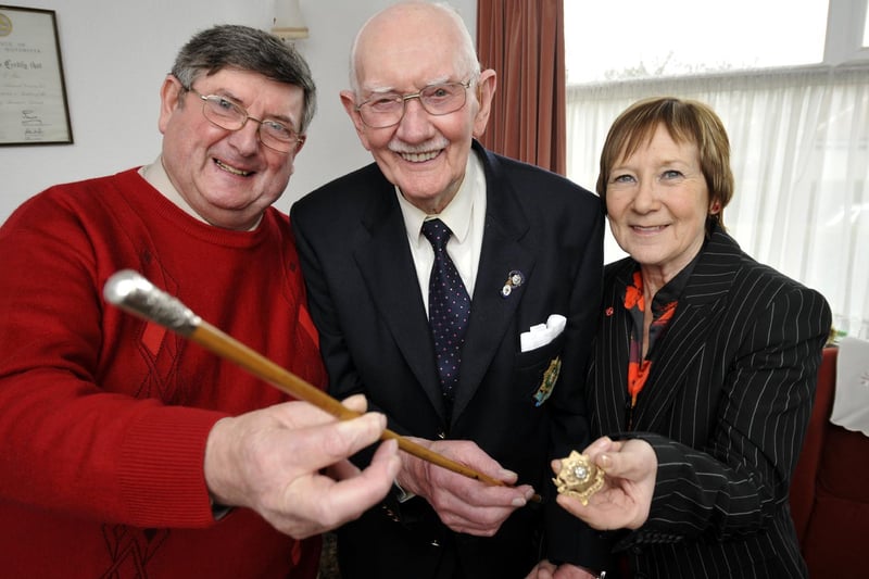 Bernard Raw (centre) hands over his treasured East Yorks Regiment officer's stick, and cap badge, to Trevor Romans (L), who donated £100 and a bonus £20 to the Royal British Legion Poppy Appeal, collected by Beryl Anderson, Scarborough RBL Poppy Appeal co-ordinator.