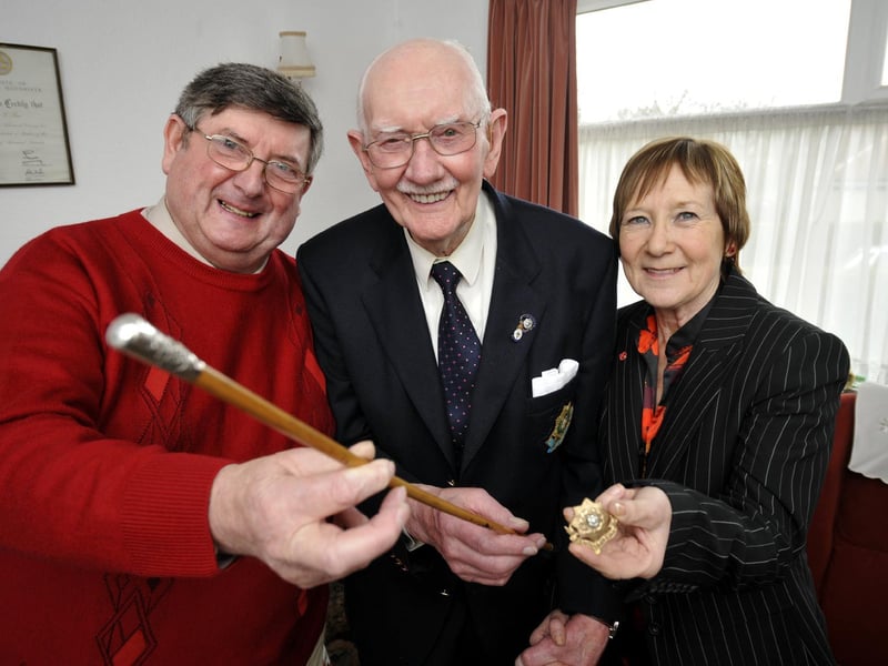 Bernard Raw (centre) hands over his treasured East Yorks Regiment officer's stick, and cap badge, to Trevor Romans (L), who donated £100 and a bonus £20 to the Royal British Legion Poppy Appeal, collected by Beryl Anderson, Scarborough RBL Poppy Appeal co-ordinator.