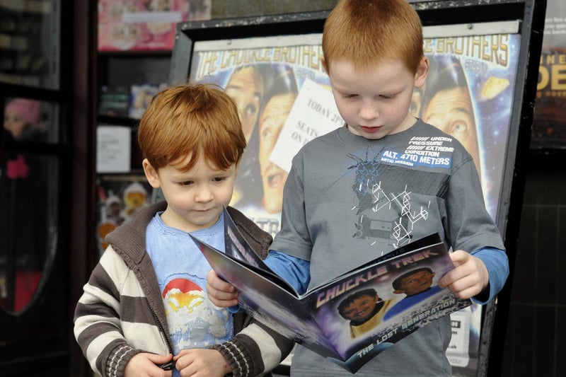 Fans Tyler, 4 and Rhys Woodall, 7 from Eastfield, read up on the Chuckle Brothers show in Scarborough.
