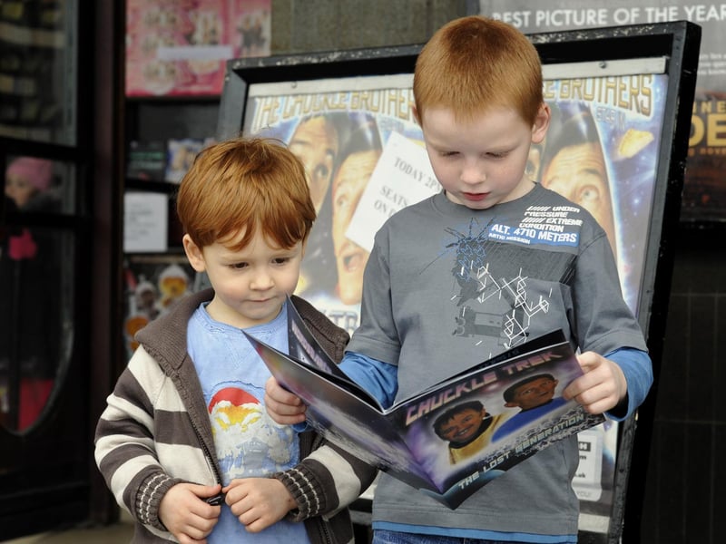 Fans Tyler, 4 and Rhys Woodall, 7 from Eastfield, read up on the Chuckle Brothers show in Scarborough.