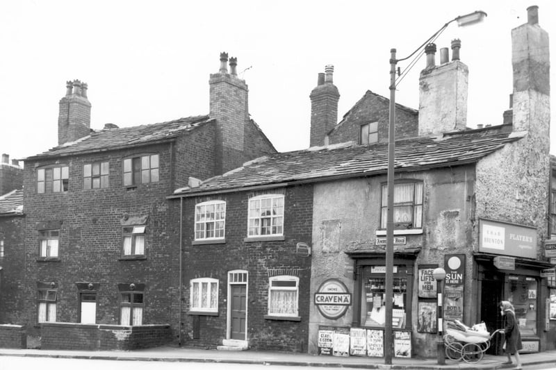 The junction of Amberley Road and Tong Road in May 1965. The photo features a sweet and tobacco shop and newsagents, business of E.H. and D. Brunton. Posters advertise various magazines and newspapers including an article on Face Lifts for Men in Reveille.