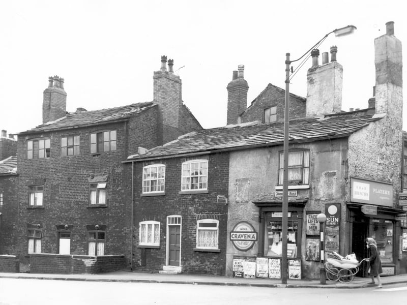 The junction of Amberley Road and Tong Road in May 1965. The photo features a sweet and tobacco shop and newsagents, business of E.H. and D. Brunton. Posters advertise various magazines and newspapers including an article on Face Lifts for Men in Reveille.