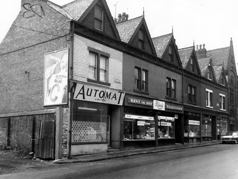 Amberley Buildings on Tong Road in May 1965. Businesses include Automat Ltd, Rhinds, television contractors and dealers as well as a hairdressers, owned by Albert H. Meechan.