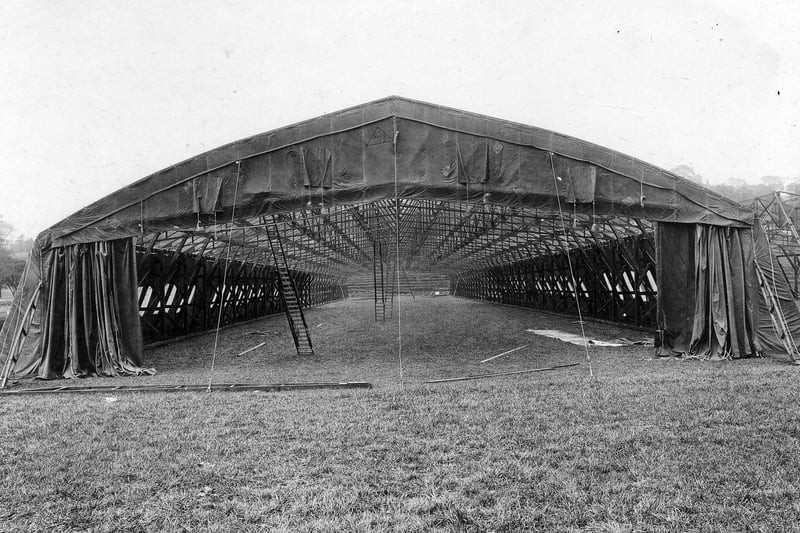 A temporary aircraft hangar put up in the arena of Roundhay Park for the display of war planes and artefacts.