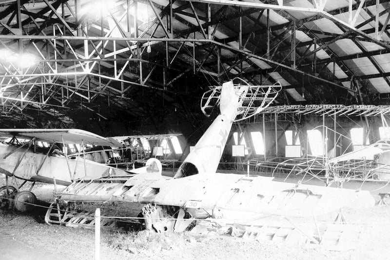 Two of the best known fighter planes used by the Imperial German Air Service. The wrecked aircraft in the centre had crashed from a height of 6,000 feet. It is an Albatross Scout (with dummy), type D.V.