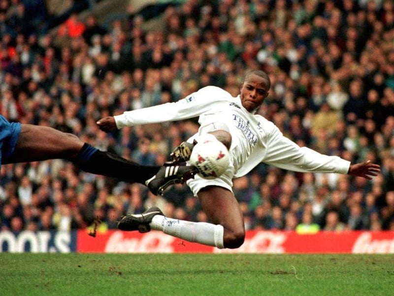 An acrobatic Phil Masinga fires towards goal.