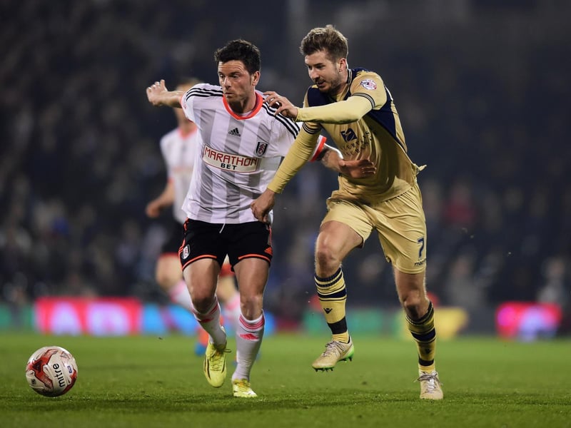 Luke Murphy battles with Fulham's Tim Hoogland.