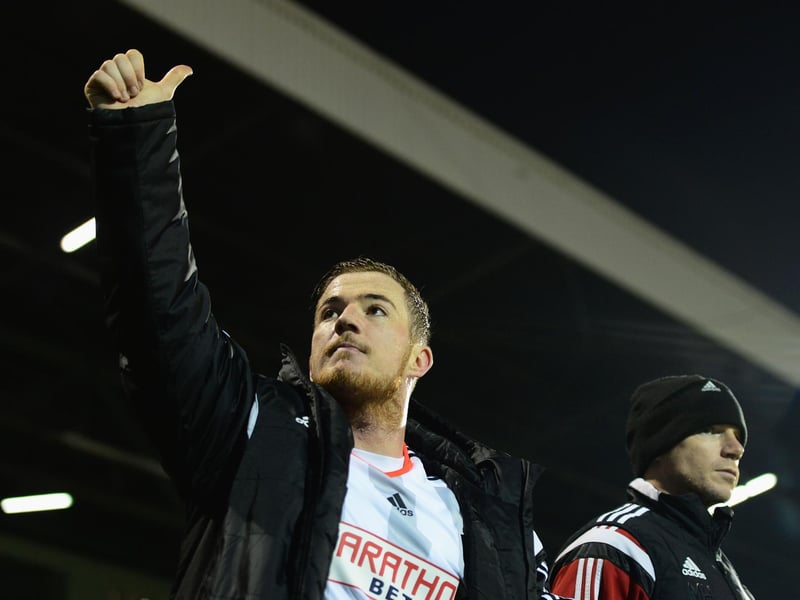 Former Leeds United striker Ross McCormack salutes the travelling fans.