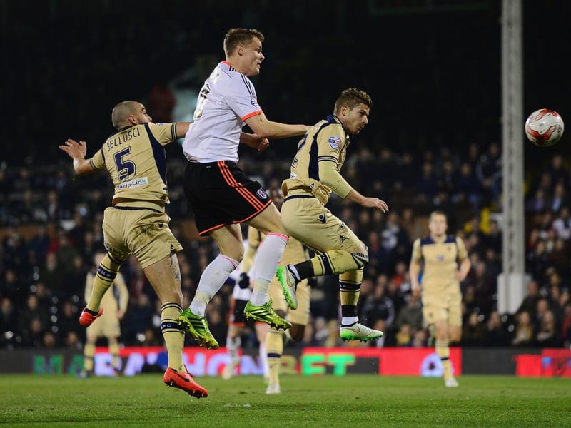 Fulham's Matt Smith outjumps Giuseppe Bellusci (left) and Gaetano Berardi.