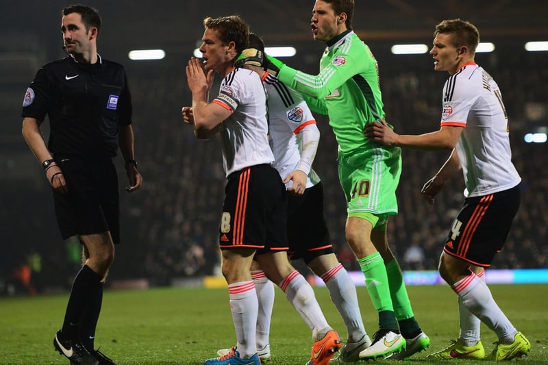 Fulham's Scott Parker leads the protests to referee Chris Kavanagh after defender Kostas Stafylidis (not pictured) was dismissed for two quick bookings.