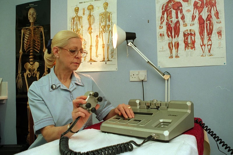 Inside Bramley Complimentary Therapy Clinic in January 1998. Pictured is physiotherapist Angela Warren with a power assisted micro manipulation machine.