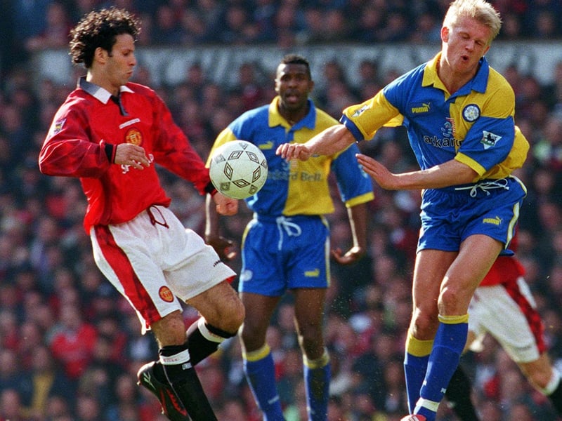 Alf-Inge Haaland blocks the ball from Manchester United's Ryan Giggs during the Premier League clash at Old Trafford in May 1998. The Red Devils won 3-0.