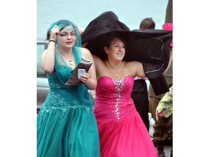 Making a dash in the rain after arriving by an Army Jeep were Bethany Singh and Stacie Hull.