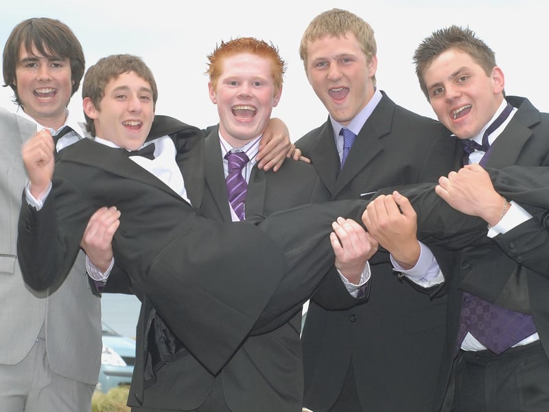 A group of friends mess around outside the venue.