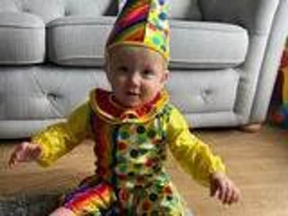 Rennon Jermy, 10 months, celebrated their first Comic Relief as a clown jester.