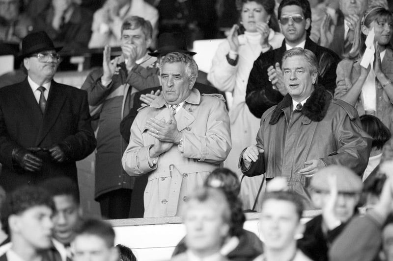 Leeds chairman Leslie Silver celebrates victory with managing director Bill Fotherby in the stand.