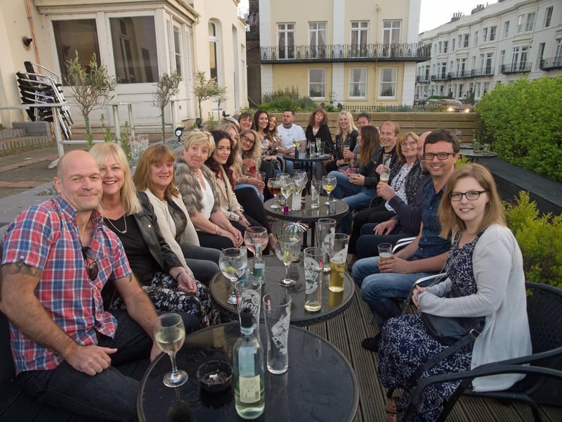 Work colleagues help Kath celebrate her birthday on the terrace of the Ink Bar, in 2015.