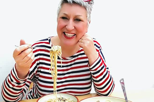 Karen enjoys her delicious mushroom stroganoff