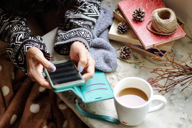 Woman scrolls through social media apps