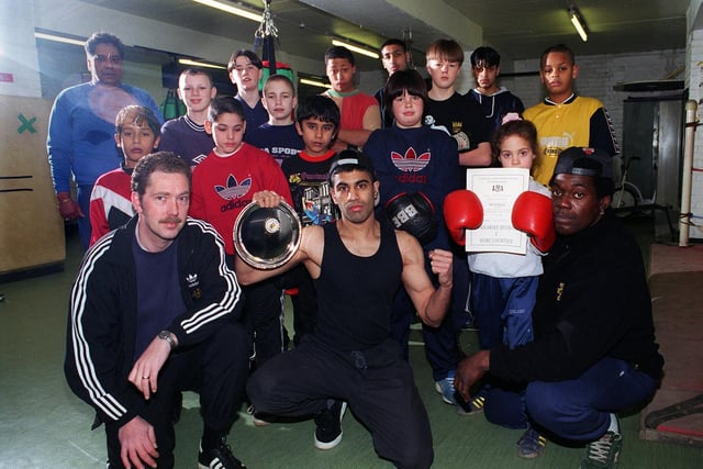 Burmantofts Boxing Club, front left to right, Steve Franks and boxer Tariq Hussain who won the Yorkshirte v Home Counties Shield. He is pictured with trainer Lee Brown, with club members looking on behind.