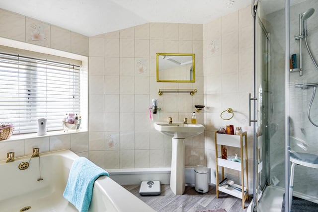 The family bathroom is split into two, as is common in older properties, and the shower and bath area is separate from the toilet.