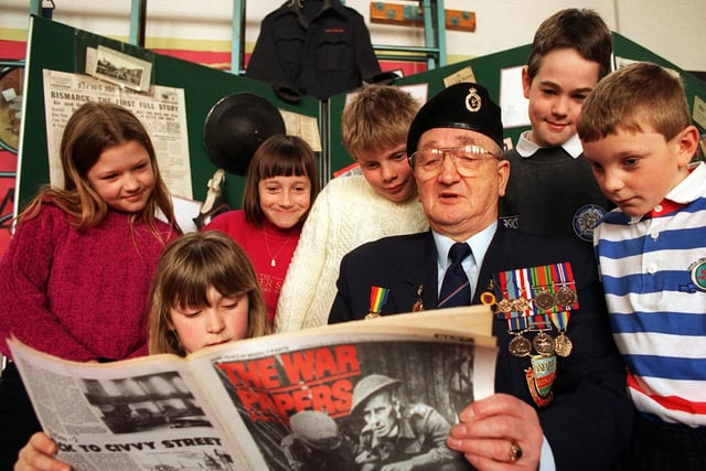 The past and the present came together at Temple Newsam Halton Primary when ex- soldiers met school children to talk over their experiences. Pictured is Normandy veteran Ken Bell chatting with, from left, Gemma Healeas, Stephanie Roberts, Sarah Curtis, Andrew Braham, Michael Steele and Paul Wilson.