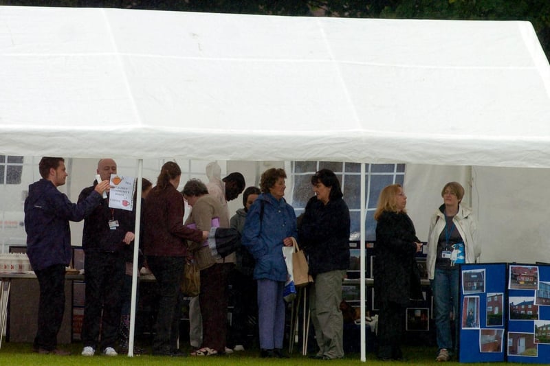 Revellers shelter from the rain at Seacroft Gala in July 2008.