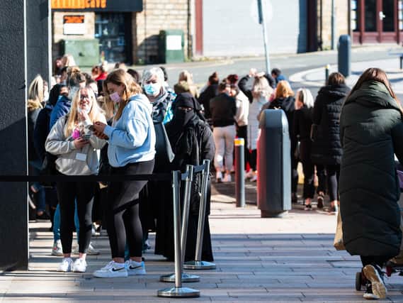 Shoppers queuing outside Primark in Burnley