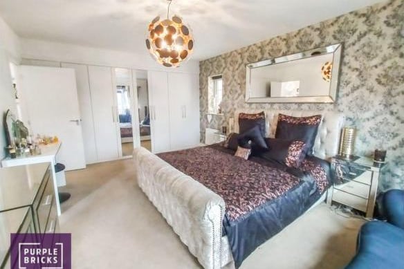 The large master bedroom is light and spacious and has fitted wardrobes. The en-suite benefits from a bath and a separate shower cubicle.