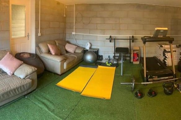 There is a large double garage which is being used by the current owners as a gym.